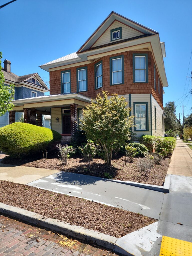 sidewalk driveway curb brick pavement house exterior